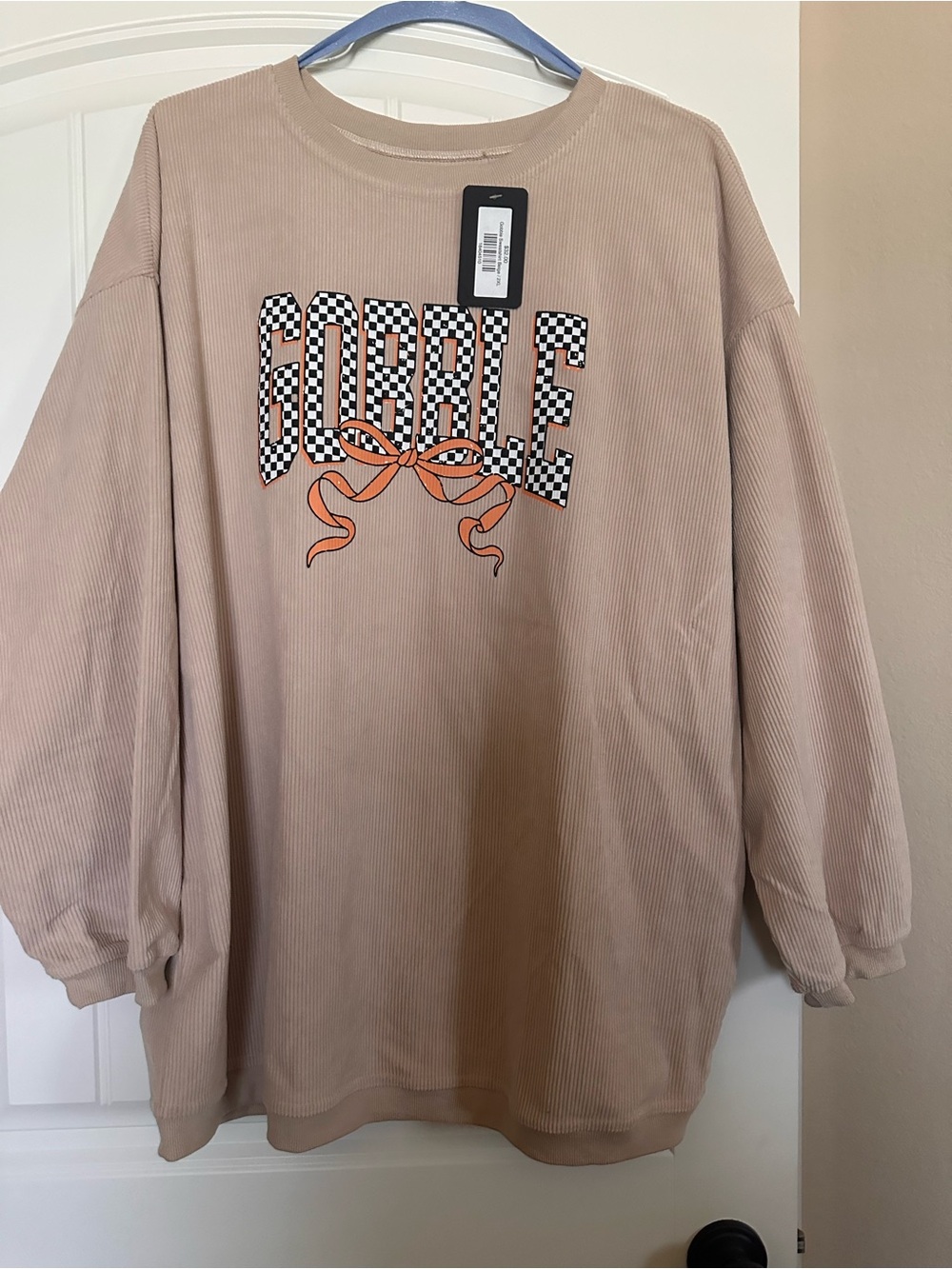 Graphic Corduroy Sweatshirt with Checkerboard 'Gobble” Detail